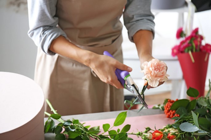 cutting flower stems with scissors